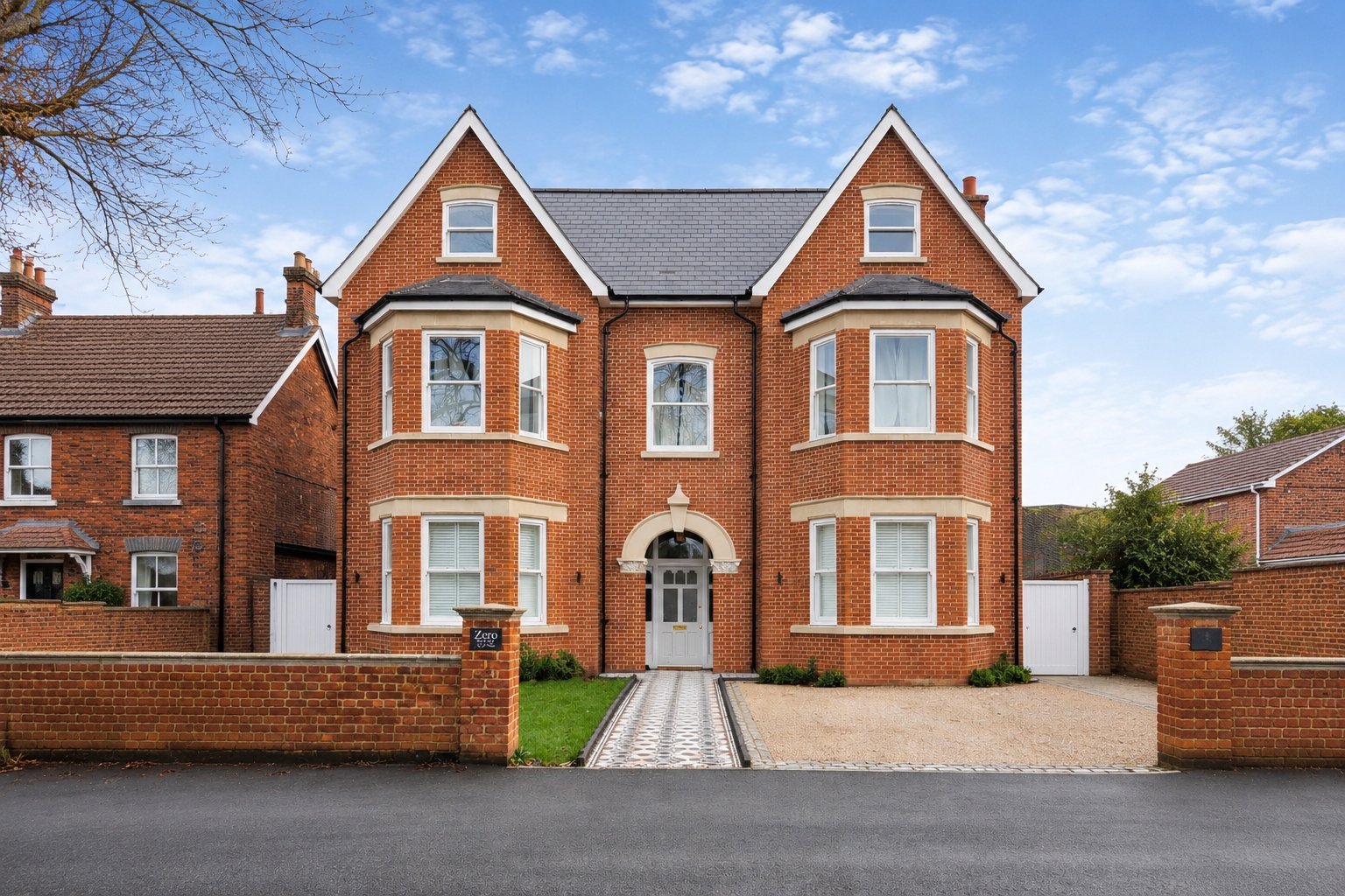 Large red brick period detached house with two distinctive gable roofs, multiple windows and white trim, representing the type of older Bedfordshire property Box and Defeo build and renovate
