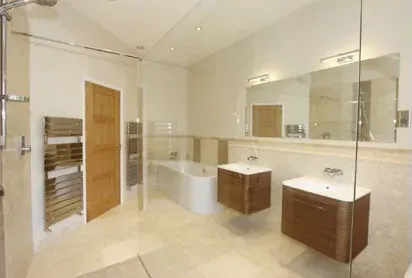 there is a bathroom with a glass shower door and two sinks