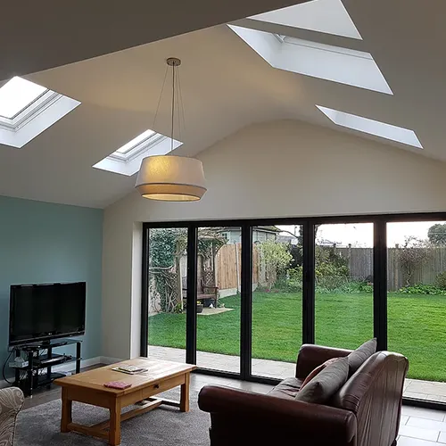 a living room filled with furniture and a flat screen tv