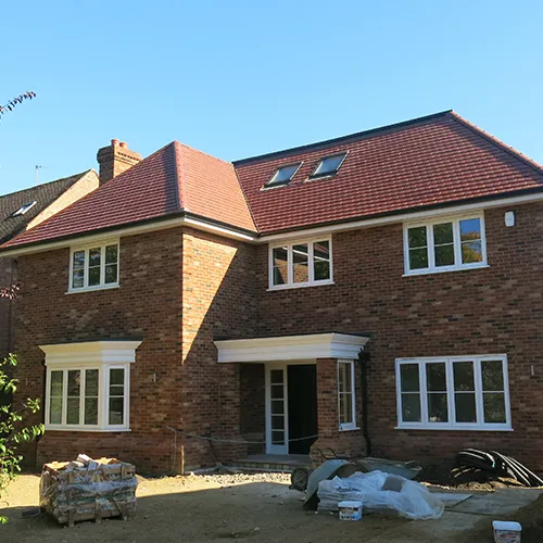 a large brick house with white trim and windows