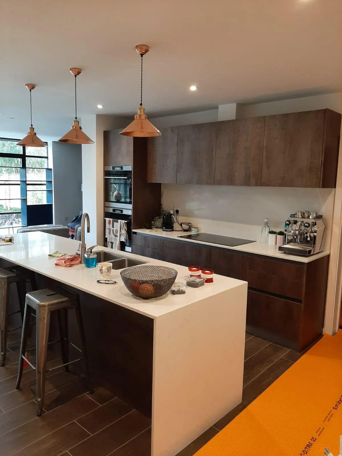 there is a kitchen with a center island and a bar